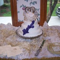 Parents 50Th First cake ever done. Never took any classes trying to find some in my area now. I loved trying to see what I could do. I will keep on...