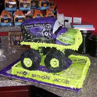 Grave Digger Grave Digger, made out of fondant, bottom buttercream. Grave Digger ran on way to party and landed on floor. This is what I salvaged after...