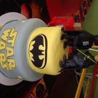Batman And Darth Vador this was for a little boy that wanted both batman and darth on his cake. made them fighting eachother on the top. figures are fondant....