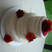 Wedding Dress Cake this is my first official wedding cake. it was done to look like the front of the brides dress. it is a 12", 9", and 6" cake...