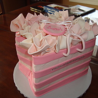 3D Victoria's Secret Bag this was for a close friend's bridal shower. buttercream cake with fondant stripes and fondant tissue paper. would do all fondant if i...