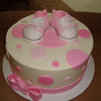 All Star Converse Shoes Baby Shower Cake 9" cake done in buttercream with fondant dots and bow. shoes were made using the instructions i found on this site. very easy to do...