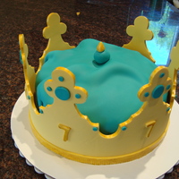 Golden Birthday Crown Cake this was for a little girl's golden birthday. she wanted a golden crown with aqua accents. the cake is an 8" cake covered in aqua...