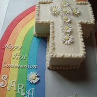 Rainbow And Cross First Communion Cake the mom asked for a cake but said she somehow wanted a rainbow incorporated. had no idea how to make that look normal. decided a fondant...