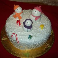 Snow Family Cake This is a matured rum cake covered in marzipan, fondant and then royal icing textured to look like snow. The snow family and accents are...