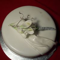 Calla Lilly Cake This is my first attept at drapping, i mixed a little gumpaste with some fondant.The lilies are handmade and slightly dusted, i added some...