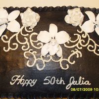 Black And White Birthday Fondant roses dusted in pearl luster dust, gumpaste orchids and buttercream frosting.