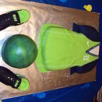Soccer This was for my daughters birthday. The shoes are RKT (Rice Krispy Treats) covered in fondant. The ball is 1/2 RKT and 1/2 cake.