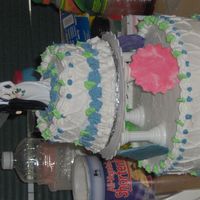 Wedding Cake first wedding cake covered in buttercream and royal icing flowers with fondant cutouts of a moon,star,sun,and flower