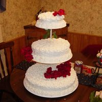 40Th Anniversary Floater buttercream rosettes all over cake. this was last minute for my neighbor. the flowers are silk.