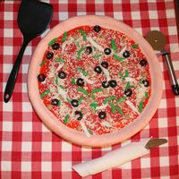 Super Bowl Pizza Cake Took the idea of this cake from the Wilton 2005 yearbook. I had a lot of fun with it. Tomato paste is Tulip Red piping gel, mozzarella is...