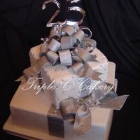 25Th Anniversary Packages 10 & 6" WASC cakes iced with vanilla IMBC and covered in fondant. All bows handmade from gumpaste, painted with real silver dust...