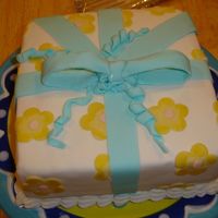 Course Iii Package Cake Made this in class yesterday. I'm not crazy about my bow. The flowers look more mustardy in the picture than they really were. Thanks...