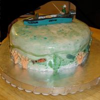 Fishing A likeness of hubby in his boat. Orange cake with cream cheese icing, cream cheese and mandarin orange filling.