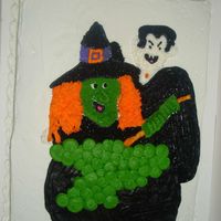 Dracula And The Witch Buttercream icing - got idea from another on CC. I had 3 cakes to do in one night. This one was the last and it was for our neighborhood...