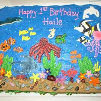 Under The Sea Used color flow for Nemo, Jellyfish, and black and white fish. Everything else is buttercream. Octopus came out a bit too thick, but it was...