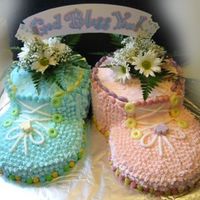 Pink & Blue Baby Booties Based on the cupcake booties found on this site but I used 8 inch round pans instead. We knew there were twins in there a boy & a girl...