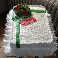 Gift Box Dominican cake with meringue frosting. Filled with dulce de leche and guava paste. Had a hell of a time with the bow and doing the strips...