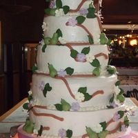 Perfect Pear Wedding Cake 4 layer 5 tier wedding cake, alternating tiers chocolate with amaretto buttercream filling & champagne with raspberry buttercream...