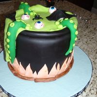Witch's Cauldron Witch's cauldron, WASC with Cookie dough filling, buttercream crumb and fondant iced. All decorations are fondant.