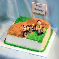 Moto X Cake WASC cake with custard filling and vanilla buttercream. Gumpaste figure and motorbike. That bike gave me a world of trouble! Never again!