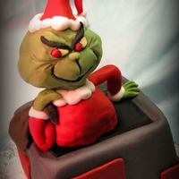Grinch Ii Chimney is red velvet cake, vanilla buttercream covered in fondant. The Grinch is RKT covered in fondant. This cake was made as a donation...