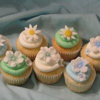 Cupcakes A variety of cupcakes to go with a tractor anniversary cake I did. I used high ratio shortening for the first time, and the icing crusted...