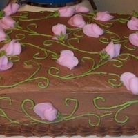 Rosebud Cake I guess this should be called a "leftover" cake. I wanted to use up all of my leftover buttercream, so I made this. The frosting...