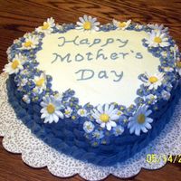 Mother's Day Cake I made this cake for my mom, she loved it and so did everyone else. It was white cake with kahlua raspberry cream filling (from this site...