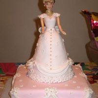 Doll Cake I posted the sugar doll photos last week. Here is the doll on the actual cake.