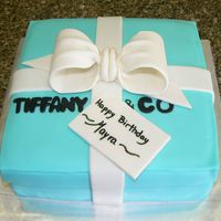 Tiffany & Co. Box This is a 8 in cake covered and decorated with fondant. The bow is a 50/50 mix of gum paste and fondant.