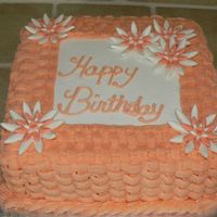 Basket Weave This is a 9in square cake. Buttercream frosting with fondant flowers.
