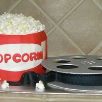 Movie Night I used 6 inch cakes and covered with fondant for the popcorn bucket. For the film I used a six inch cake and used gumpaste for the top, and...