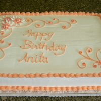 Peach Flowers This is a white cake with a strawberry banana filling. The cake is frosted in whipped icing, with fondant flowers. Thanks for looking.