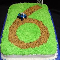 4Wheelin' To 6 Buttercream "dirt track". The dirt is a combo of graham crackers and oreos.