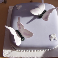 Sugar Butterflies This is a cake I made for my level 1 college course. The criteria was royal icing flood work, square cake and at least two styles of royal...