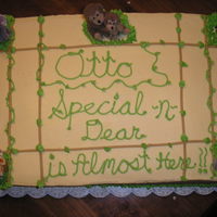 Jungle Baby Shower Cake Baby shower cake with mini plush jungle animals.