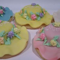 Bonnets Buttery cookies covered with chocolate fondant and decorated with Royal icing flowers. Sweet enough for Mother's Day.