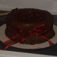 Moms Birthday Cake This cake was for my mom, its a chocolate lovers dream(which is what my mom is!!) I topped it with cherry pie filling and served it with...