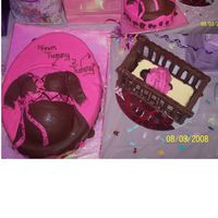Tummy 2 Tummy "Mom-to-be is half sportsball and 2 cupcakes on 13 1/2 X 9 7/8 ovalAll Fondant. Crib is Chocolate many thanks to my DH for help with...