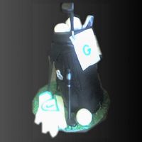 Gone Golfin' Chocolate cake w/choc. BC covered w/MMF , then airbrushed black.