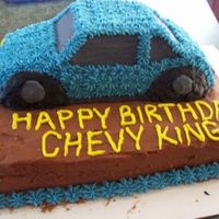 Car Cake I made this for my brothers birthday. He runs a Chevy dealership and I even made the Chevy emblem on the back. I used the 3D Cruiser pan....