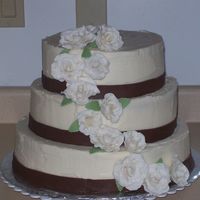 My Second Wedding Cake Bride wanted round, off white icing, no fondant w/ white roses. This is what I gave her. (we discussed the gold pearl dust on the roses in...