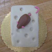 Mouse & Cheese Cake White cake, PB filling with white modeling chocolate. Marzipan mouse.