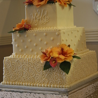 Hibiscus! First try at gumpaste hibiscus. I think it went pretty well. Was fun to do. All ivory buttercream. Vanilla Bean cake with chocolate fudge...