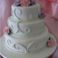 Wedding Cake Three tier cake covered in fondant and gumpaste roses