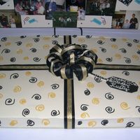 50Th Birthday Full sheet 1/2 yellow, 1/2 chocolate, buttercream icing, gold and black ribbon, I used piping gel with lustre dust to get a little metallic...