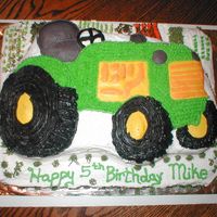 John Deer Tractor I made this for a little boy who loves john deer tractors. It is yellow cake with bc frosting. This was fun to make.
