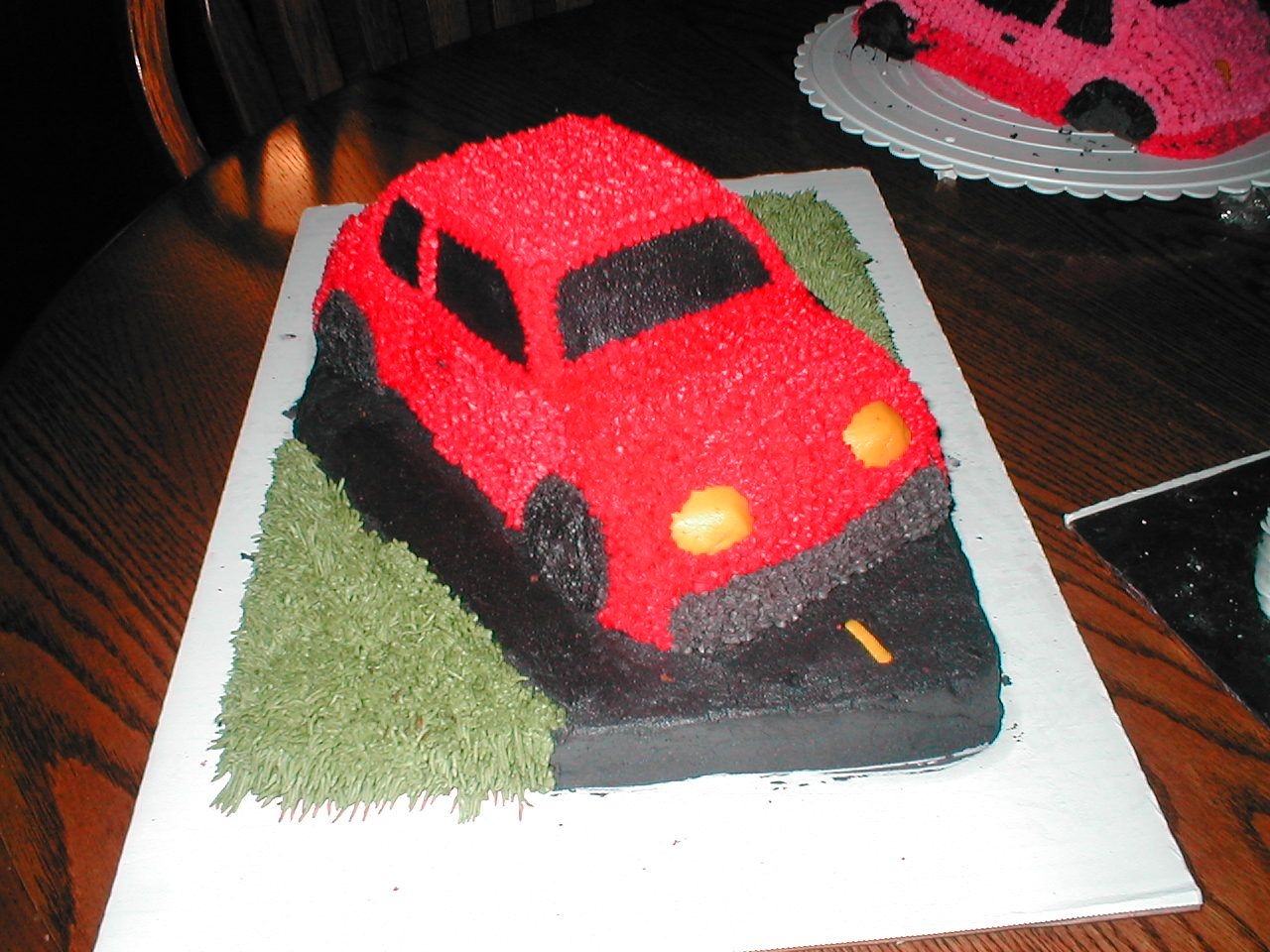 Vw Bug This is my fisrt bug. I made it for a graduate. The cake is white cake with bc frosting. It was alot of fun.