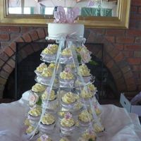 Wedding Cupcakes wedding cupcake display, choc mud with italian merigue buttercream. i had to tie a ribbon and bow around each cup cake case, there were...